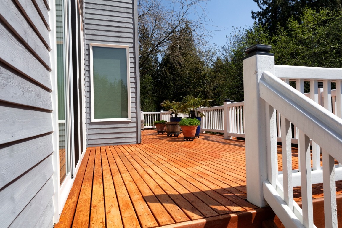 New deck with wood framing on a residential property.